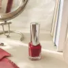 Red nail polish bottle is fashionable, color-changing, long-lasting and lustrous, a must-have for manicures details Picture